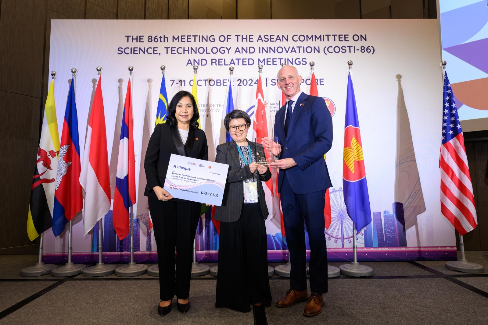 Dr. Kanchana Wanichkorn, ASEAN secretariat director of sectoral development; Dr. Daphne Teck Ching Lai, winner in the mid-career category; Mr. Michael Ronning, USAID regional development mission for Asia mission director