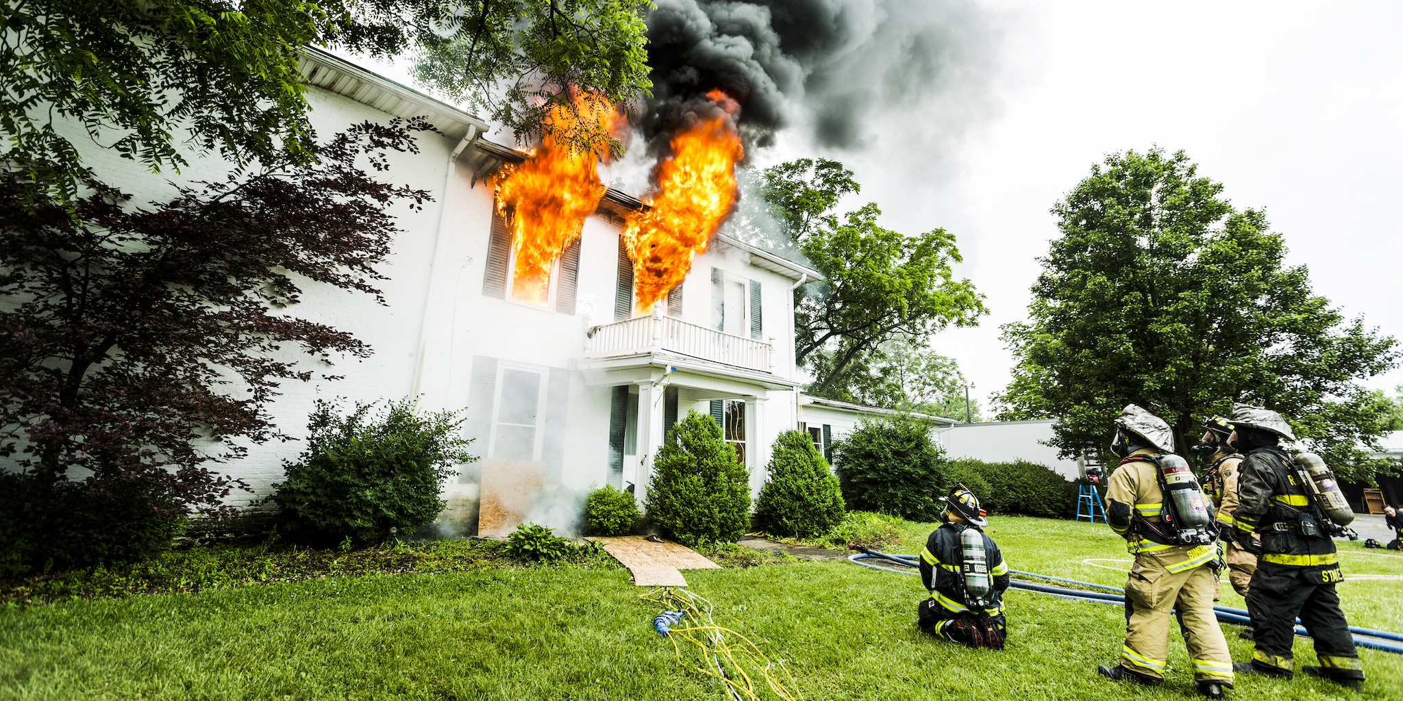 Firefighters and a building on fire