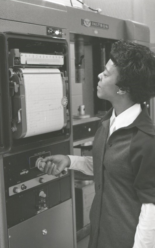 An engineering technician examines test results, ca. 1976.