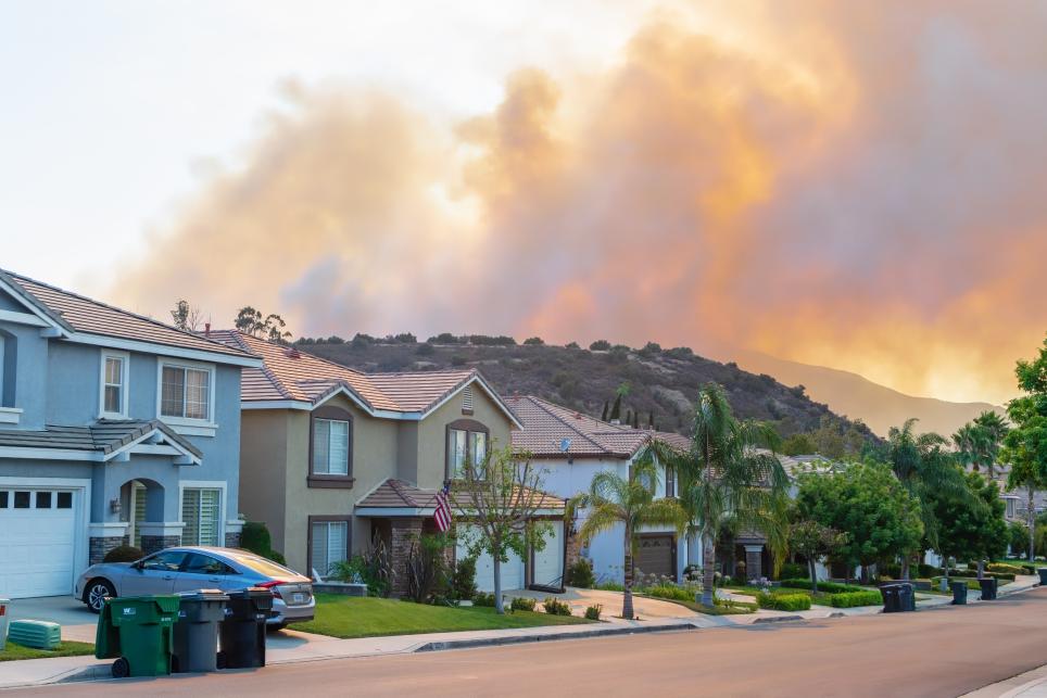 fire burning near homes in community